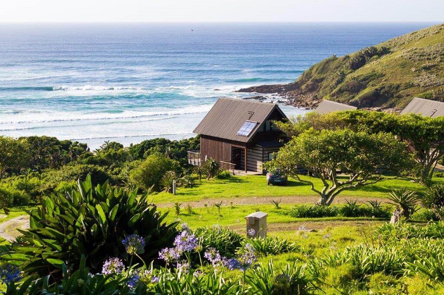 Hluleka coastline, green slopes and existing coastal chalets