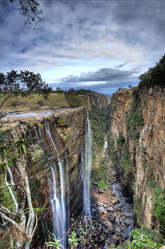 Magwa Falls descending into a steep, green gorge
